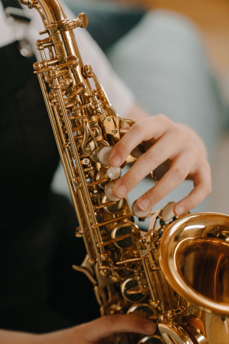 Gold saxophone against a black background